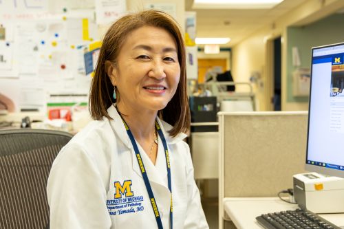 Dr. Chisa Yamada working at her desk.